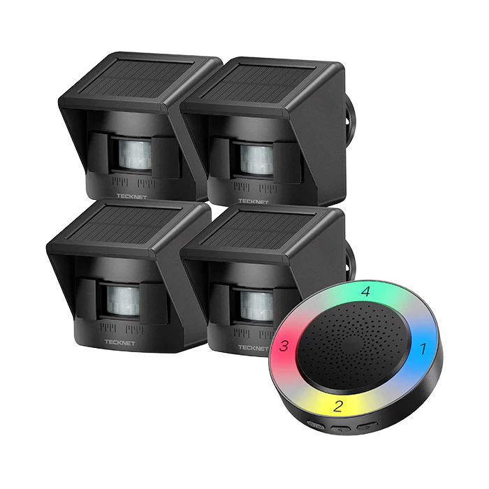 Four black solar-powered lights and a colorful remote control on a white background