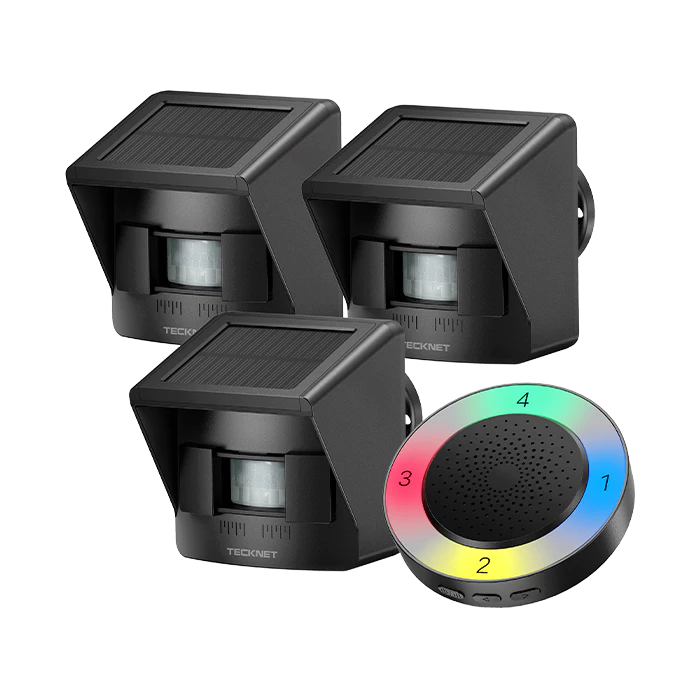 Three black solar-powered security lights with a colorful control device on a white background.